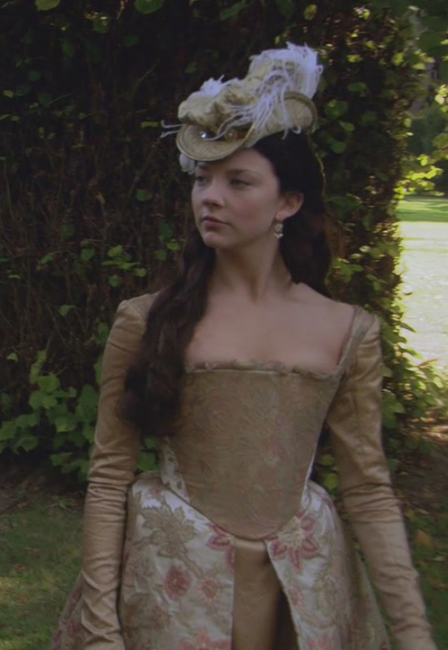 Natalie Dormer as Anne Boleyn wearing a gold gown in the 2007 series "The Tudors."