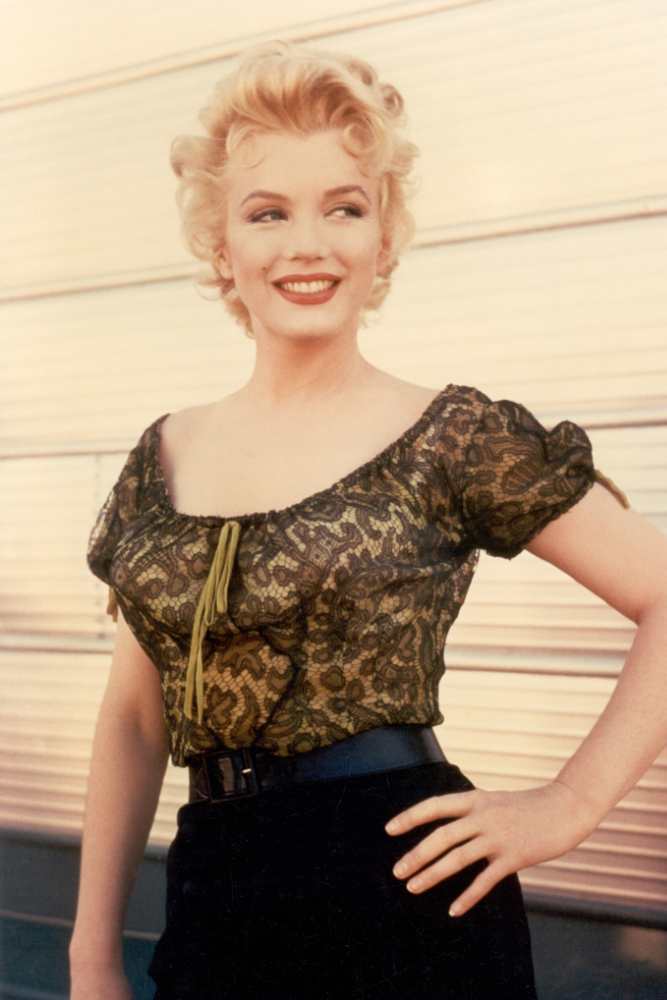 Marilyn Monroe as Chérie wearing a green lace blouse in the 1956 film "Bus Stop."