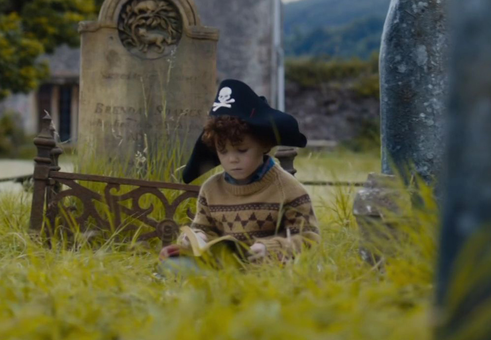 Tom Stoughton as young Sherlock Holmes wearing a tan and brown sweater in the episode "The Final Problem" of the 2017 series "Sherlock."