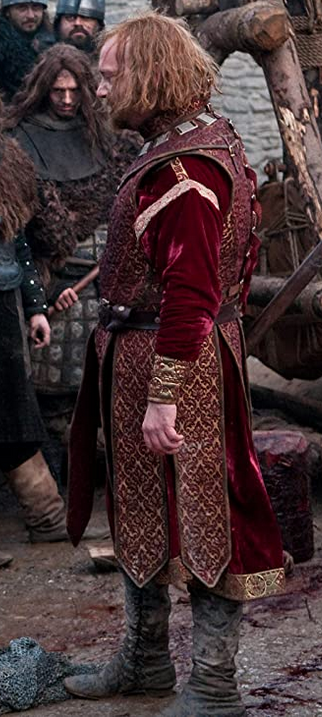 Paul Giamatti as King John wearing a gold and red damask costume in the 2011 film "Ironclad."