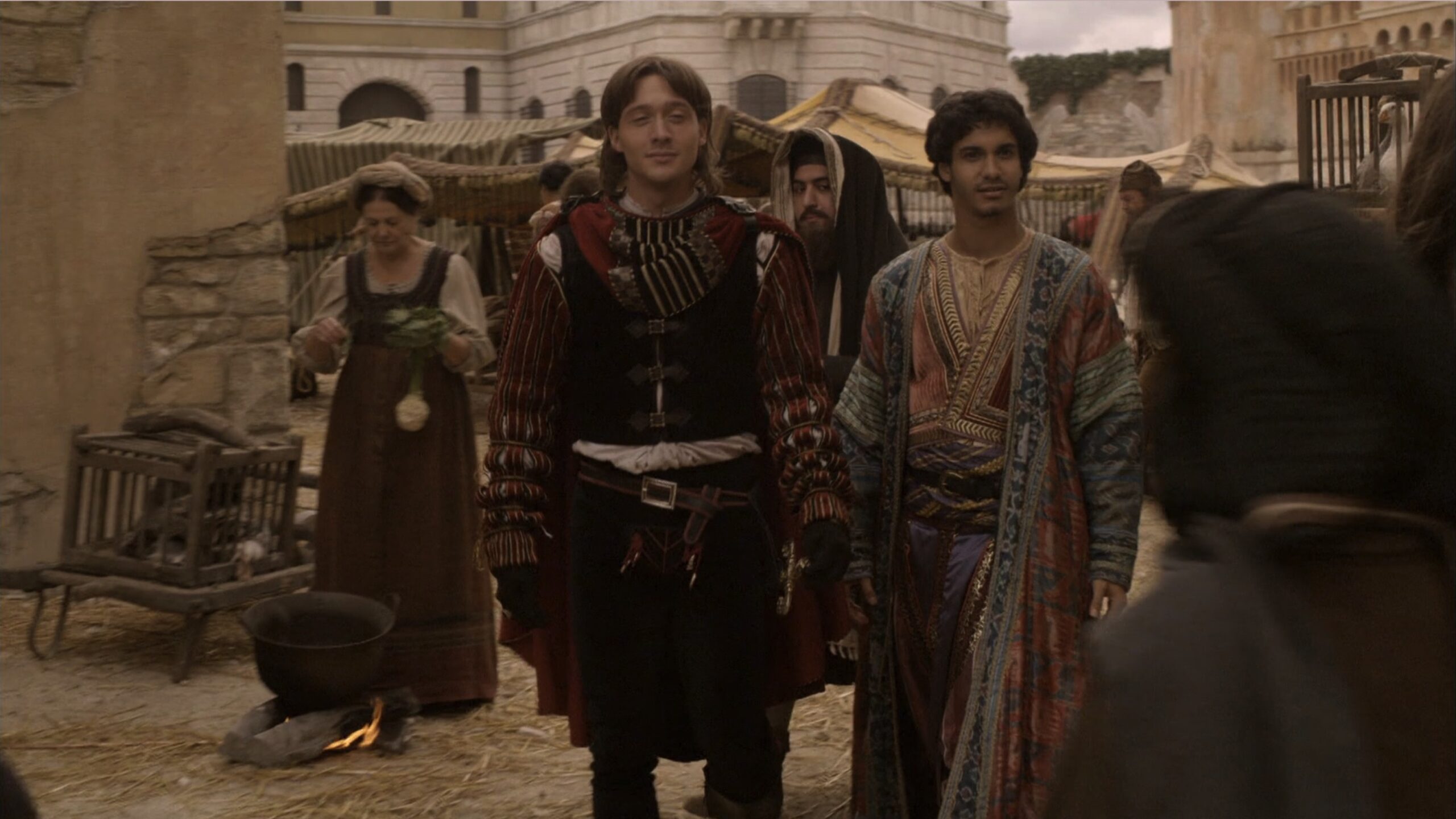 Elyes Gabel as Prince Djem wearing a blue, red and turquoise silk coat with gold detailing in the 2011 series "The Borgias."