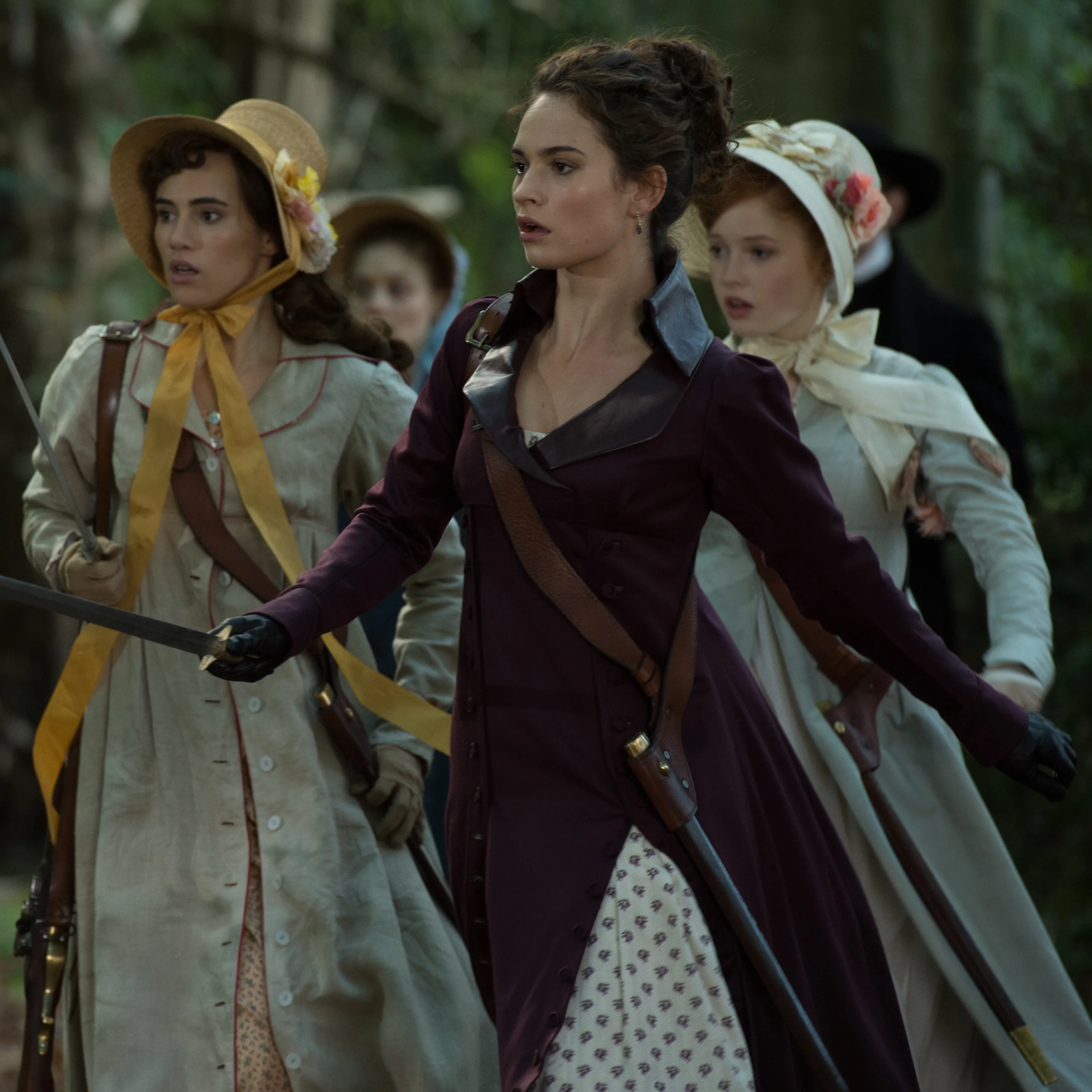 Lily James as Elizabeth Bennet wearing a purple coat with a leather collar in the 2016 film "Pride and Prejudice and Zombies."
