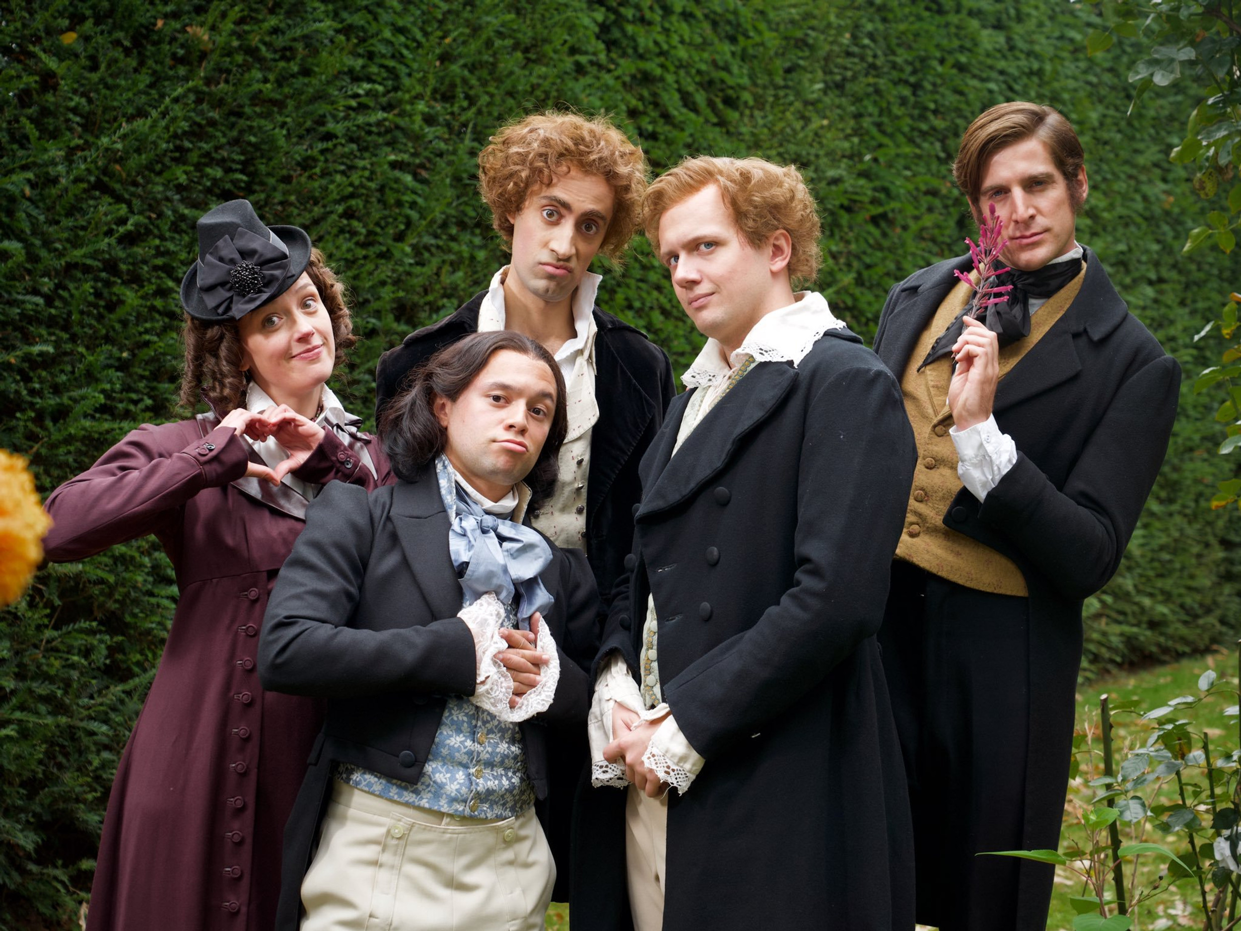 Jessica Ransom as Mary Shelley wearing a purple coat with a leather collar in the skit "The Romantic Poets Song" in the 2019 series "Horrible Histories."