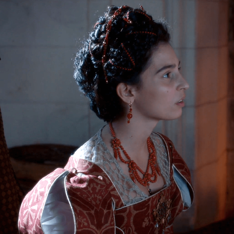 Gaia Girace as Catherine de Médicis wearing a set of coral jewelry in the 2022 miniseries "Diane de Poitiers (The King's Favorite)."