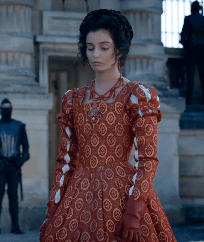 Gaia Girace as Catherine de Médicis wearing a set of coral jewelry in the 2022 miniseries "Diane de Poitiers (The King's Favorite)."