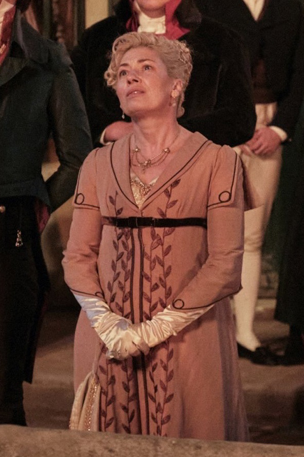 Kate Ashfield as Mary Parker wearing a light pink pelisse decorated with dark pink vines in the 2023 series "Sanditon."