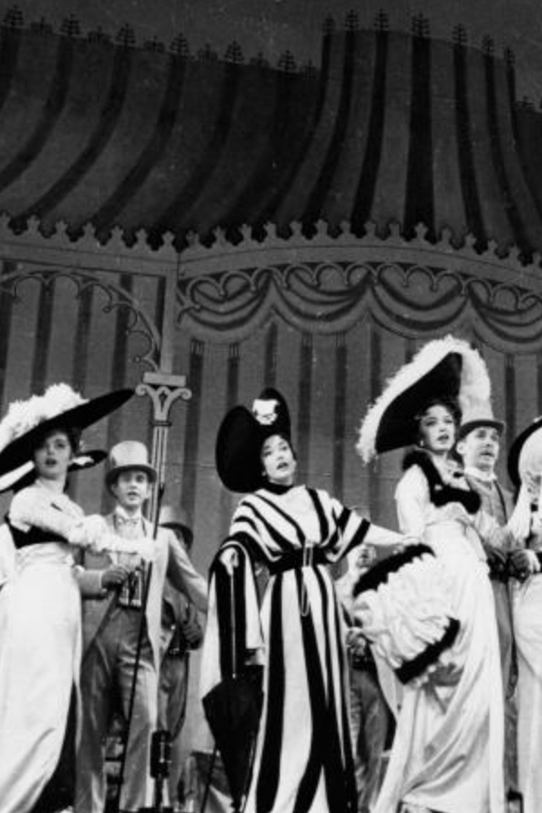 Melisande Congdon as an Ascot attendee wearing a black and white striped gown in the 1956 stage musical "My Fair Lady."