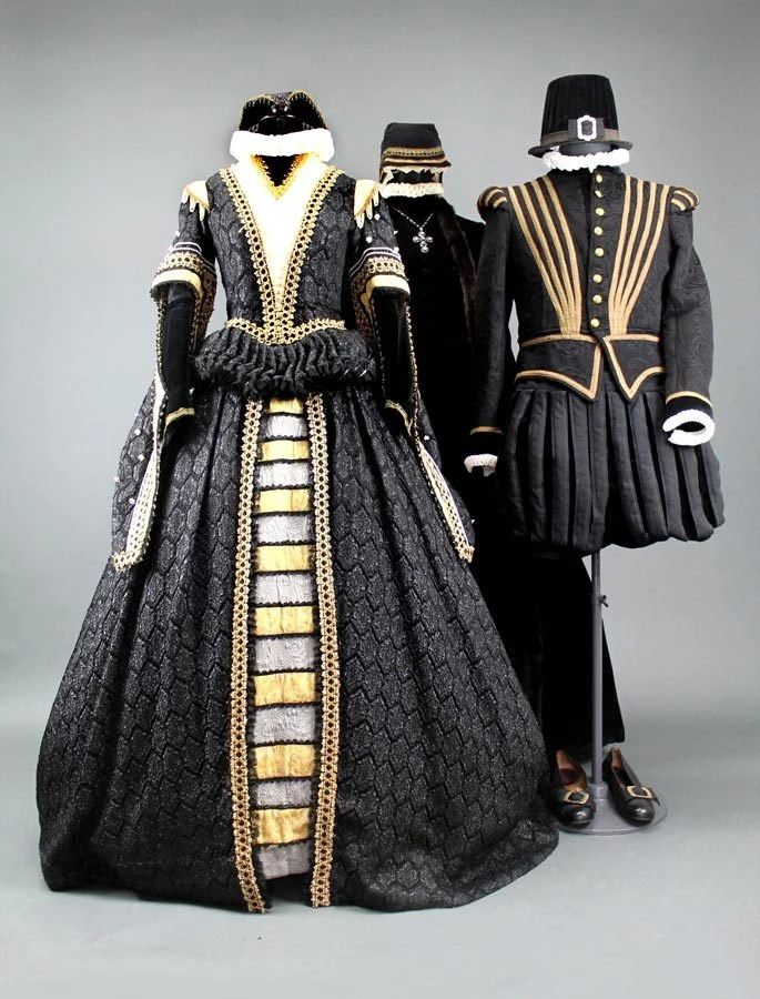 A black and gold gown on display.