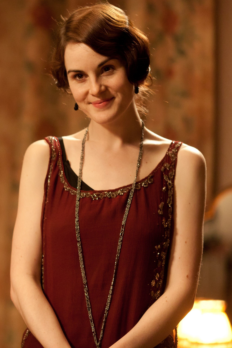 Michelle Dockery as Lady Mary Crawley wearing a burgundy gown with beading in the 2012 series "Downton Abbey."