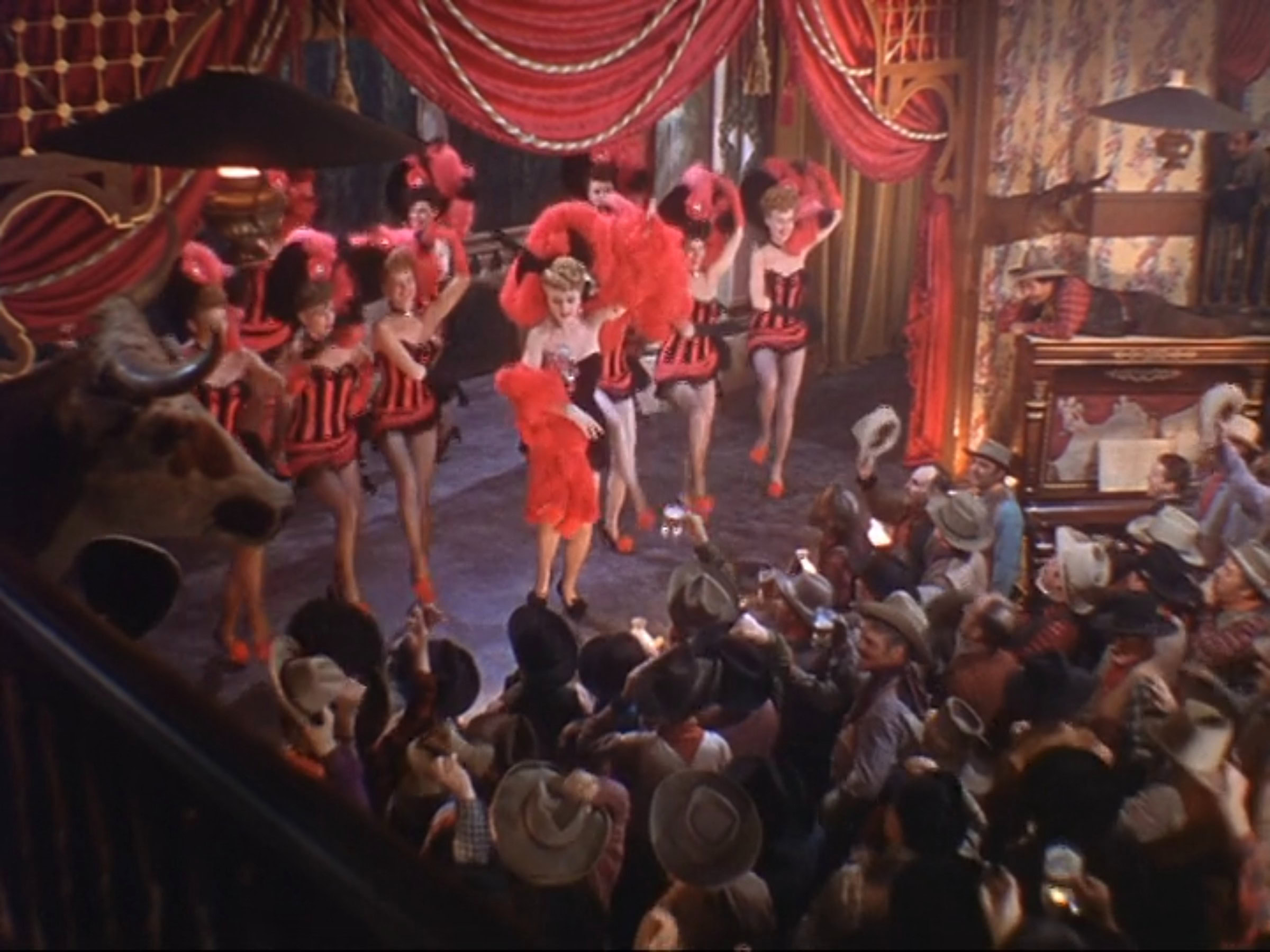 Extras as showgirls wearing black and red striped showgirl costumes in the 1946 film "The Harvey Girls."