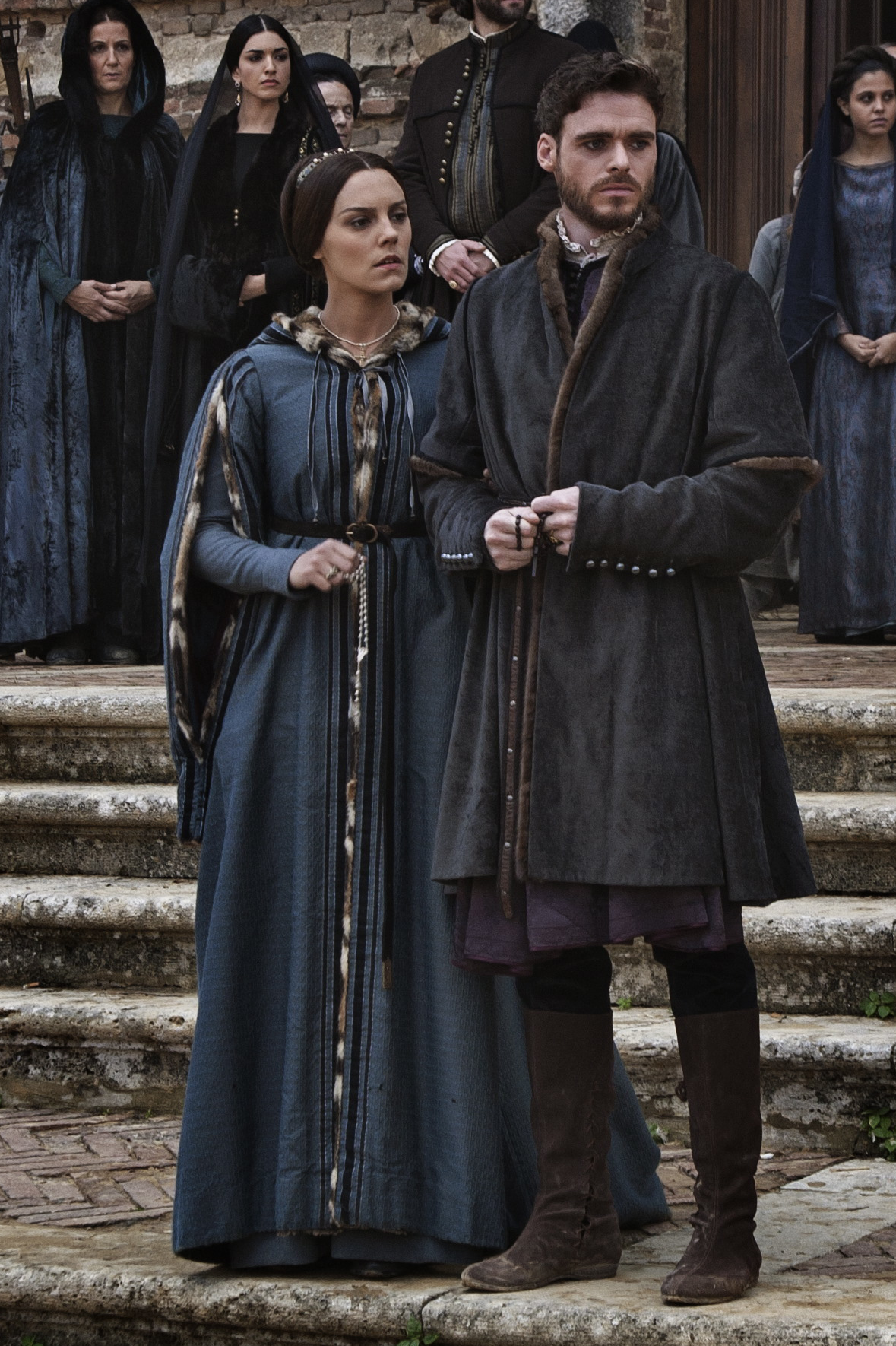 Annabel Scholey as Contessina wearing a blue cloak in the 2016 series "Medici: Masters of Florence."